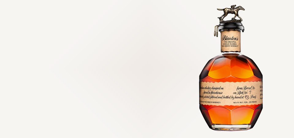 bourbon and whisky banner image includes a bottle of Blanton bourbon